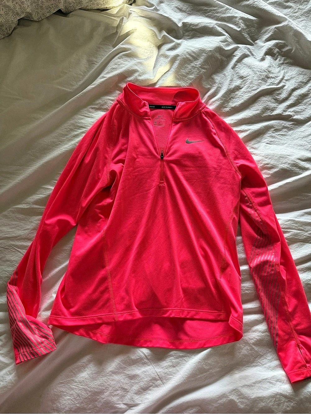 Nike Running quarter-zip pullover in Pink